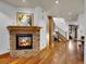 Cozy living room with a stone fireplace and open access to the foyer and staircase at 383 S Franklin St, Denver, CO 80209