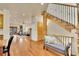 Inviting living room with hardwood floors, stone fireplace, and seamless flow to the entryway at 383 S Franklin St, Denver, CO 80209