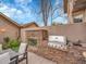 Beautiful outdoor stone fireplace and stainless grill on the back patio at 383 S Franklin St, Denver, CO 80209