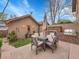 Outdoor patio with stone fireplace, built-in grill and dining set is perfect for entertaining at 383 S Franklin St, Denver, CO 80209