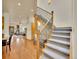 Elegant staircase with wrought iron railing, leading to a view of the living area at 383 S Franklin St, Denver, CO 80209