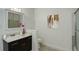 Well-lit bathroom with vanity, decorative mirror, and shower-tub combination at 2565 S Sheridan Blvd # 14, Lakewood, CO 80227