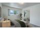 Comfortable bedroom with mirrored closet, complemented by natural light and neutral tones at 2565 S Sheridan Blvd # 14, Lakewood, CO 80227