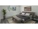 Serene bedroom with a comfortable bed, bench, and neutral decor, perfect for relaxation at 2565 S Sheridan Blvd # 14, Lakewood, CO 80227