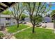 Apartment complex with lush green lawn and mature trees; ample parking at 2565 S Sheridan Blvd # 14, Lakewood, CO 80227