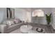 Bright living room boasts modern decor, comfortable seating, and stylish bar overlooking kitchen area at 2565 S Sheridan Blvd # 14, Lakewood, CO 80227