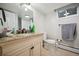 Clean basement bathroom with granite vanity and updated fixtures at 4360 S Alton Ct, Greenwood Village, CO 80111