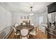 Formal dining room with a large round table and chandelier at 4360 S Alton Ct, Greenwood Village, CO 80111