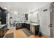 Modern kitchen features dark cabinetry, stainless steel appliances, and quartz countertops at 4360 S Alton Ct, Greenwood Village, CO 80111