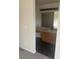 Bathroom vanity with light wood cabinets, matte black hardware, and laminate counters at 6240 Everett Ct # D, Arvada, CO 80004