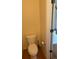 Cozy bathroom with a modern toilet and wood-look vinyl flooring at 6240 Everett Ct # D, Arvada, CO 80004
