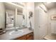 Updated bathroom features modern fixtures, a sleek vanity, and convenient storage solutions at 6240 Everett Ct # D, Arvada, CO 80004