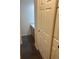 Bathroom vanity with light wood cabinets, matte black hardware, and dark tile floors at 6240 Everett Ct # D, Arvada, CO 80004