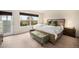 Inviting bedroom with a large window, stylish furnishings, and access to an outdoor balcony at 6240 Everett Ct # D, Arvada, CO 80004