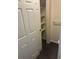 Pantry with white wood shelving and a full door at 6240 Everett Ct # D, Arvada, CO 80004