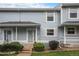 Charming townhome with light blue siding, white shutters, and a welcoming front porch at 6240 Everett Ct # D, Arvada, CO 80004