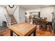 Open-concept living and dining area with hardwood floors and a staircase, perfect for entertaining at 6240 Everett Ct # D, Arvada, CO 80004