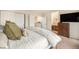 Comfortable main bedroom showcasing a walk-in closet, connecting bathroom, and a plush bed at 6240 Everett Ct # D, Arvada, CO 80004
