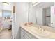 Well-lit bathroom featuring a large mirror and ample vanity space at 7193 S Newport Way, Centennial, CO 80112
