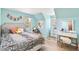 Bedroom featuring wood floors, a bed with textured bedding, and a vanity at 7193 S Newport Way, Centennial, CO 80112