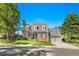 Charming two-story home with brick and siding, well-maintained lawn, and attached garage at 7193 S Newport Way, Centennial, CO 80112