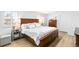 Comfortable main bedroom with stylish furniture, neutral tones, hardwood flooring, and ample natural light at 7193 S Newport Way, Centennial, CO 80112