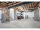 Unfinished basement area with exposed utilities and concrete floors at 13267 E 108Th Ave, Commerce City, CO 80022