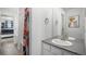 Clean bathroom with a shower/tub combo and modern vanity at 13267 E 108Th Ave, Commerce City, CO 80022