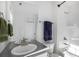 Bathroom with a single sink, large mirror, and bathtub at 13267 E 108Th Ave, Commerce City, CO 80022