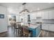 Modern kitchen with granite countertops, white cabinets, and a large island at 13267 E 108Th Ave, Commerce City, CO 80022