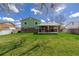 Large backyard with green lawn and covered patio, great for outdoor activities at 4555 E 121St Ct, Thornton, CO 80241