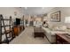 Spacious basement with plush carpeting, comfortable seating, and entertainment center at 4555 E 121St Ct, Thornton, CO 80241
