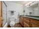 Bathroom with a glass enclosed shower and custom wood vanity at 4555 E 121St Ct, Thornton, CO 80241