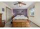 Cozy bedroom featuring a ceiling fan, natural lighting, and closet storage at 4555 E 121St Ct, Thornton, CO 80241