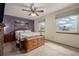 Bedroom with a patterned accent wall and two windows providing natural light at 4555 E 121St Ct, Thornton, CO 80241