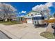 Charming two-story home featuring a large trailer on the driveway, brick accents and a spacious two-car garage at 4555 E 121St Ct, Thornton, CO 80241