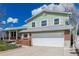 Charming two-story home featuring a manicured lawn, brick accents, and a spacious two-car garage at 4555 E 121St Ct, Thornton, CO 80241