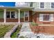 Charming two-story home featuring a manicured lawn, brick accents, and a welcoming front porch at 4555 E 121St Ct, Thornton, CO 80241