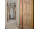 Hallway with wood doors and neutral carpeting, illuminated by recessed lighting at 4555 E 121St Ct, Thornton, CO 80241