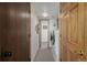 Hallway featuring a washer and dryer along with various wooden doors at 4555 E 121St Ct, Thornton, CO 80241