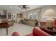 Inviting living room with neutral tones, staircase access, and natural light at 4555 E 121St Ct, Thornton, CO 80241