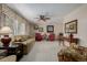 Comfortable living room with floral accents, neutral walls, and large window at 4555 E 121St Ct, Thornton, CO 80241