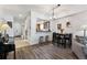 Dining room with hardwood floors features a dining table and view of the kitchen at 7250 Eastmoor Dr # 122, Denver, CO 80237