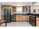 Well-lit kitchen features stainless steel appliances, tiled backsplash, and ample cabinetry at 7250 Eastmoor Dr # 122, Denver, CO 80237