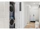 Convenient laundry area with stacked washer and dryer at 7250 Eastmoor Dr # 122, Denver, CO 80237