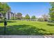 Expansive lawn offers a tranquil green space and picturesque community setting at 7250 Eastmoor Dr # 122, Denver, CO 80237