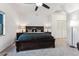 Spacious main bedroom with a plush bed, and ample closet space at 7250 Eastmoor Dr # 122, Denver, CO 80237