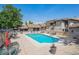 Community pool with ample seating, and lush landscaping offering a resort-like experience at 7250 Eastmoor Dr # 122, Denver, CO 80237