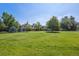 Sprawling lawn and manicured landscape create a serene and inviting community atmosphere at 7250 Eastmoor Dr # 122, Denver, CO 80237
