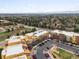 Aerial view of a condo community showcasing lush greenery and mountain views at 9019 E Panorama Cir # D320, Englewood, CO 80112